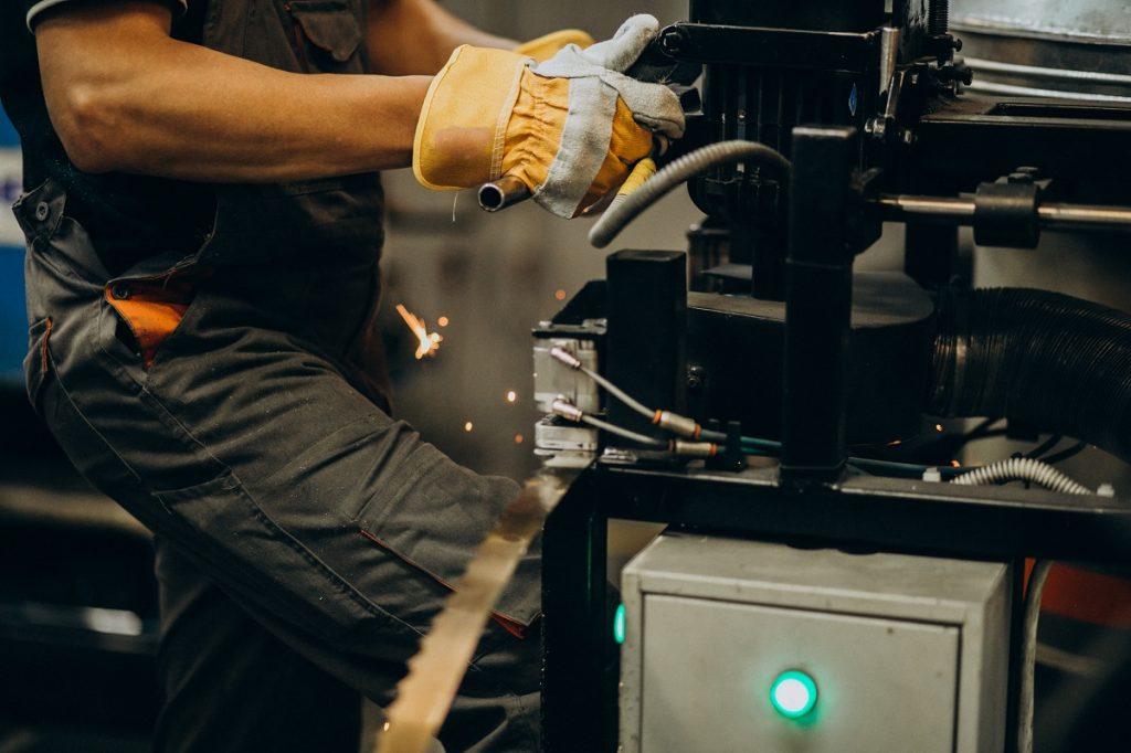 Man working on steel fatory and equipment for steel production