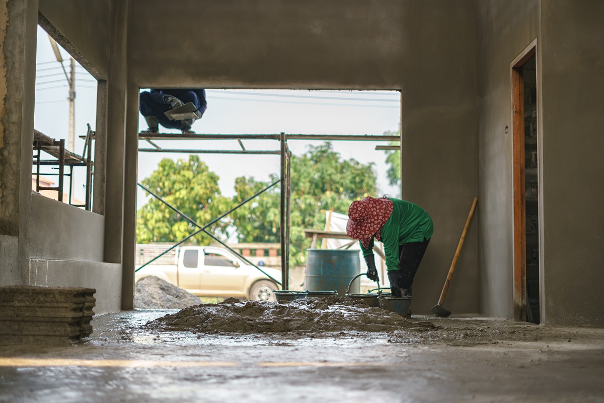 Asian worker labor working with concrete cement