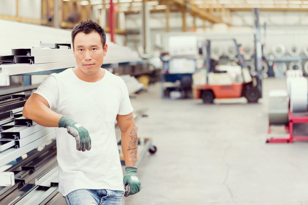 Asian worker in production plant on the factory floor