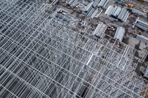 erial view of steel framework and construction materials at a project site